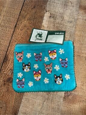 Karma living cat face Pom Pom pouch new with flaws